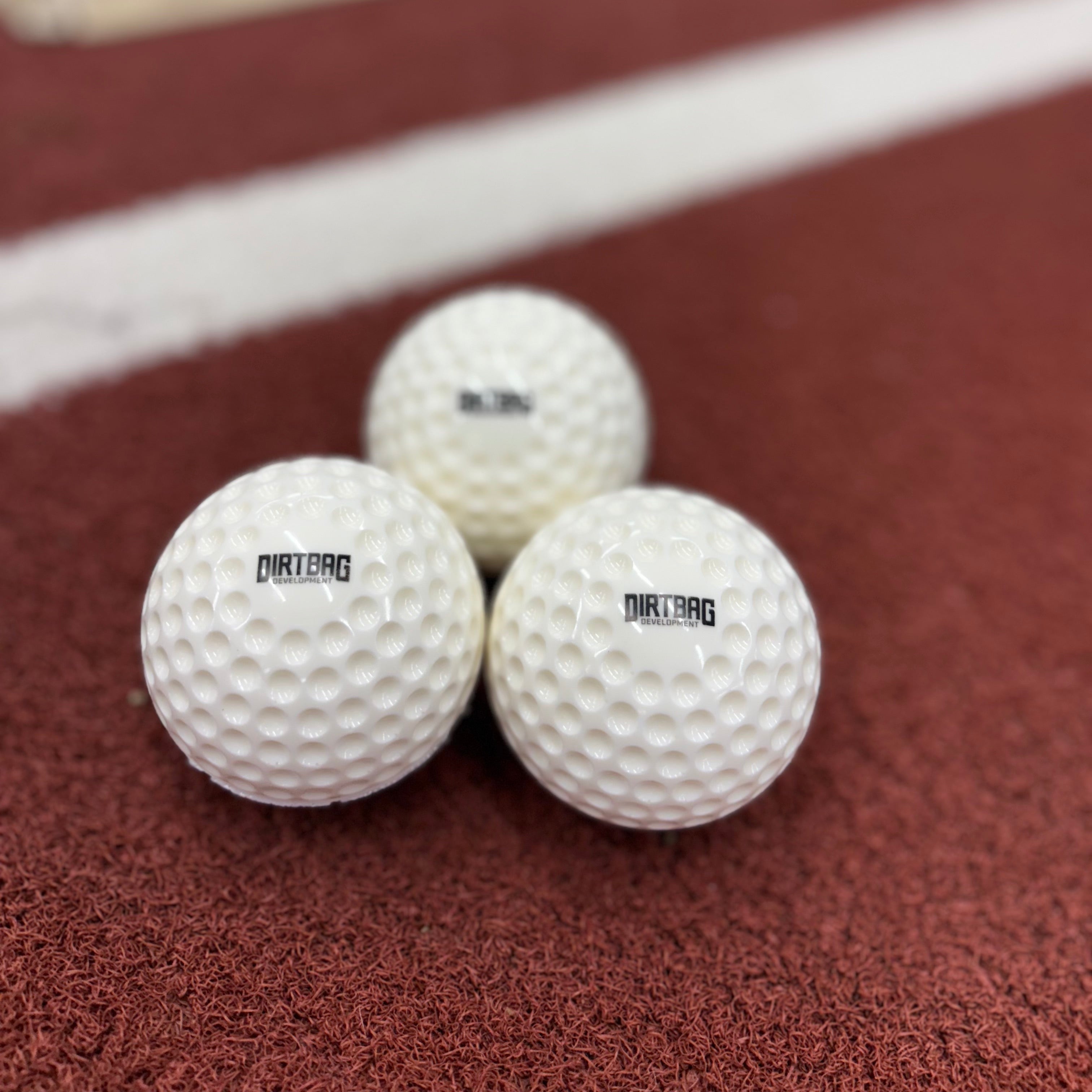 Three white Dimple Baseball Machine Balls